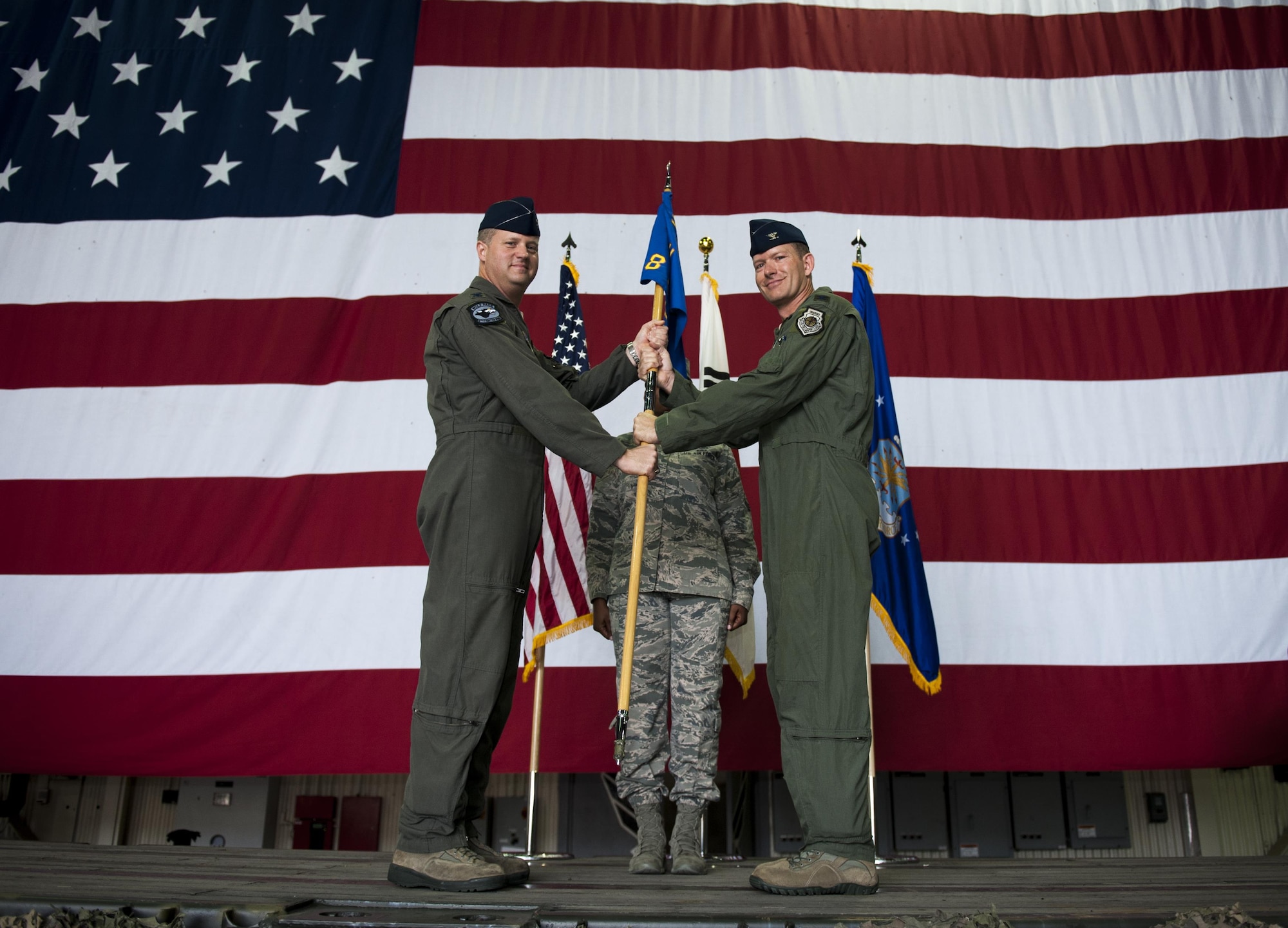 U.S. Air Force Col. Kristopher Struve, 8th Operations Group commander, receives the guidon from Col. David Shoemaker, 8th Fighter Wing commander, during an assumption of command ceremony at Kunsan Air Base, Republic of Korea, July 31, 2017. Shoemaker presided over the ceremony in which Struve took command of the 8th OG and, upon assuming the position, received the title of “Viper.” (U.S. Air Force photo by Senior Airman Colville McFee/Released)