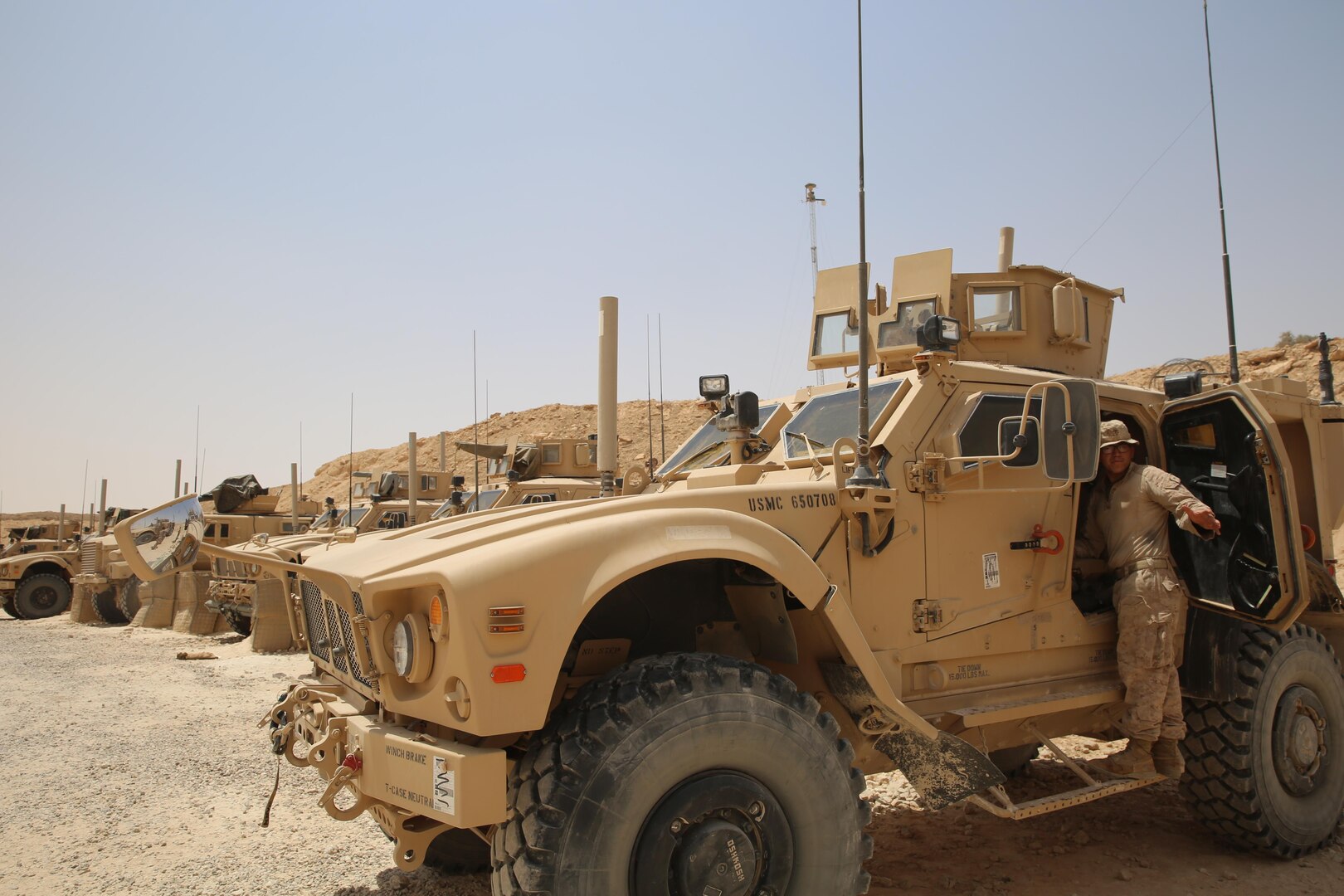 U.S. Marine Corps Lance Cpl. Johnny Perez, a mortarman assigned to Task Force Al Asad, with 1st Battalion, 7th Marines, Special Purpose Marine Air-Ground Task Force-Crisis Response-Central Command, loads gear into a mine-resistant, ambush-protected all-terrain vehiclewhile at Al Asad Air Base, Iraq, July 5, 2017. These Marines are part of the Task Force’s coalition security force team in charge of providing security to the base and personnel onboard. Task Force Al Asad’s mission is to advise and assist and build partner capacity with the Iraqi Security Forces in Al Anbar province in support of Combined Joint Task Force-Operation Inherent Resolve, the global coalition to defeat ISIS in Iraq and Syria. (U.S. Marine Corps photo by 1st Lt. Dave Williams)