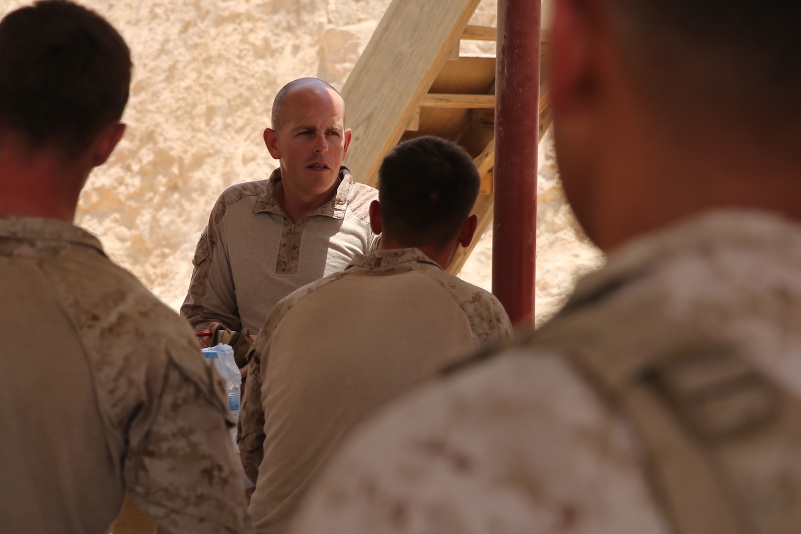U.S. Marine Corps Gunnery Sgt. Tracy Cazee, security force detachment operations chief attached to Task Force Al Asad with 1st Battalion, 7th Marine Regiment, from Special Purpose Marine Air-Ground Task Force-Crisis Response-Central Command, briefs his Marines prior to assuming their security positions while at Al Asad Air Base, Iraq, July 5, 2017. These Marines are part of the Task Force’s coalition security force team in charge of providing security to the base and personnel onboard. Task Force Al Asad’s mission is to advise and assist  and build partner capacity with the Iraqi Security Forces in Al Anbar province in support of Combined Joint Task Force-Operation Inherent Resolve, the global coalition to defeat ISIS in Iraq and Syria. (U.S. Marine Corps photo by 1st Lt. Dave Williams)