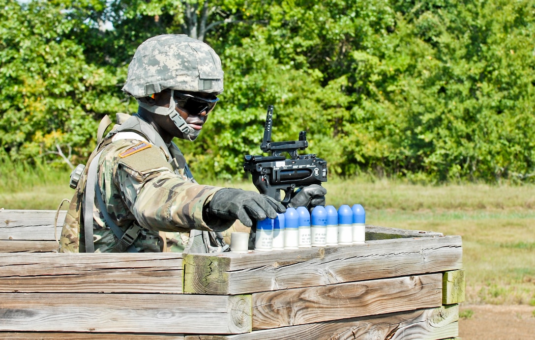 Spc. Ibukunoluwa Korede, a U.S. Army Reserve wheeled vehicle mechanic and electrical engineering student with the 844th HHC, Engineer Battalion, 411th Engineer Brigade, 412th Theater Engineer Command, prepares to load and familiarize fire the new M320 40mm grenade launcher during River Assault 2017 at Fort Chaffee Maneuver Center, Ark., July 24, 2017. River Assault 2017 is a two-week extended combat training exercise held July 15-28 focusing on technical skills, of various service members, culminating with the construction of a floating improved ribbon bridge across the Arkansas River.  (U.S. Army Reserve Photo by Staff Sgt. Roger Ashley)