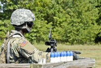 Spc. Ibukunoluwa Korede, a U.S. Army Reserve wheeled vehicle mechanic and electrical engineering student with the 844th HHC, Engineer Battalion, 411th Engineer Brigade, 412th Theater Engineer Command, prepares to load and familiarize fire the new M320 40mm grenade launcher during River Assault 2017 at Fort Chaffee Maneuver Center, Ark., July 24, 2017. River Assault 2017 is a two-week extended combat training exercise held July 15-28 focusing on technical skills, of various service members, culminating with the construction of a floating improved ribbon bridge across the Arkansas River.  (U.S. Army Reserve Photo by Staff Sgt. Roger Ashley)