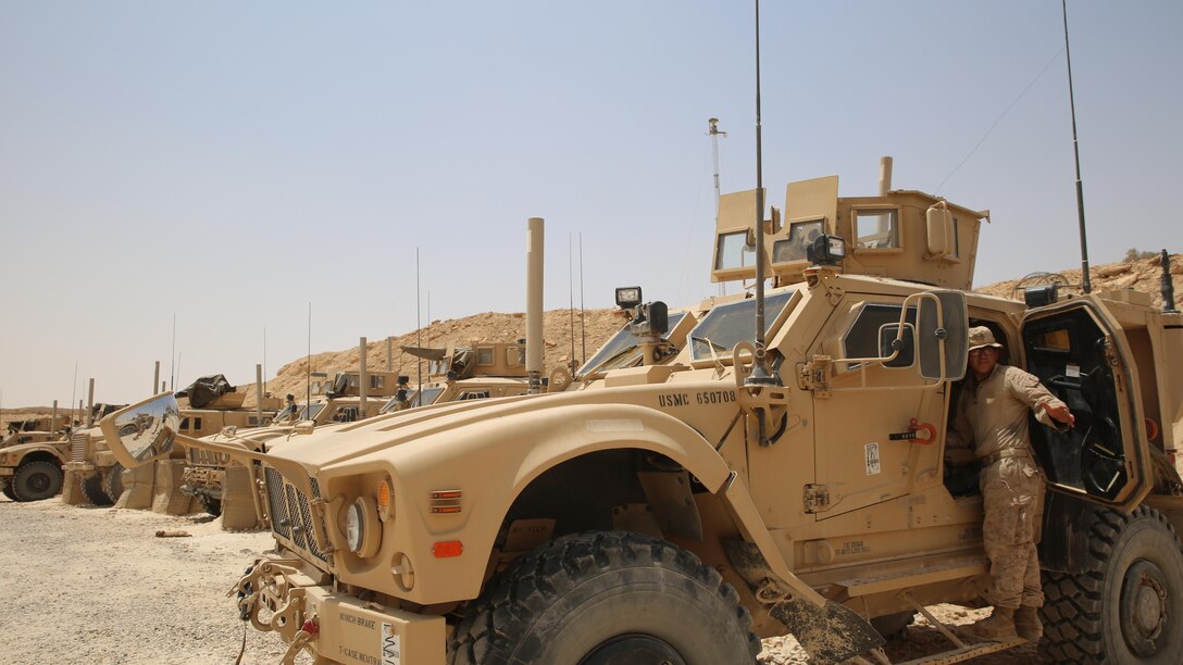U.S. Marine Corps Lance Cpl. Johnny Perez, a mortarman assigned to Task Force Al Asad, with 1st Battalion, 7th Marines, Special Purpose Marine Air-Ground Task Force-Crisis Response-Central Command, loads gear into a mine-resistant, ambush-protected all-terrain vehiclewhile at Al Asad Air Base, Iraq, July 5, 2017. These Marines are part of the Task Force’s coalition security force team in charge of providing security to the base and personnel onboard. Task Force Al Asad’s mission is to advise and assist and build partner capacity with the Iraqi Security Forces in Al Anbar province in support of Combined Joint Task Force-Operation Inherent Resolve, the global coalition to defeat ISIS in Iraq and Syria. (U.S. Marine Corps photo by 1st Lt. Dave Williams)