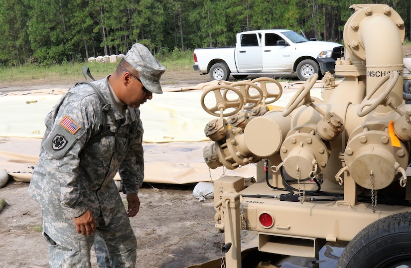 U.S. Army Reserve Chief Warrant Officer 2 Ronald Hinshaw, a Petroleum Systems Technician with the 809th Quartermaster Liaison Detachment, inspects petroleum equipment during the two-week 2017 Quartermaster Liquid Logistics Exercise in Ft. Bragg, NC, Jul. 14 to 27, 2017.  QLLEX allows U.S. Army Reserve units to demonstrate their skills and provide real-world fuel and water support while training at the tactical, operational, and strategic level.  (U.S. Army Reserve Photo by Maj. Brandon R. Mace)