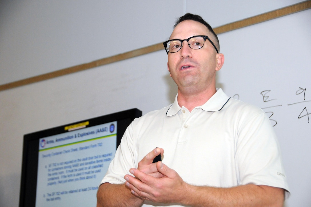 Greg Pavick, physical security specialist for the U.S. Army Reserve’s 99th Regional Support Command, instructs over 50 students during the Physical Inspector Officer Training Course hosted by the 99th RSC July 12-13 at the Timmermann Center on Joint Base McGuire-Dix-Lakehurst, New Jersey. The physical security students received training on protection of sensitive items such as weapons and night-vision goggles, proper control of keys and other access-control devices, and structural standards for Army Reserve facilities.
