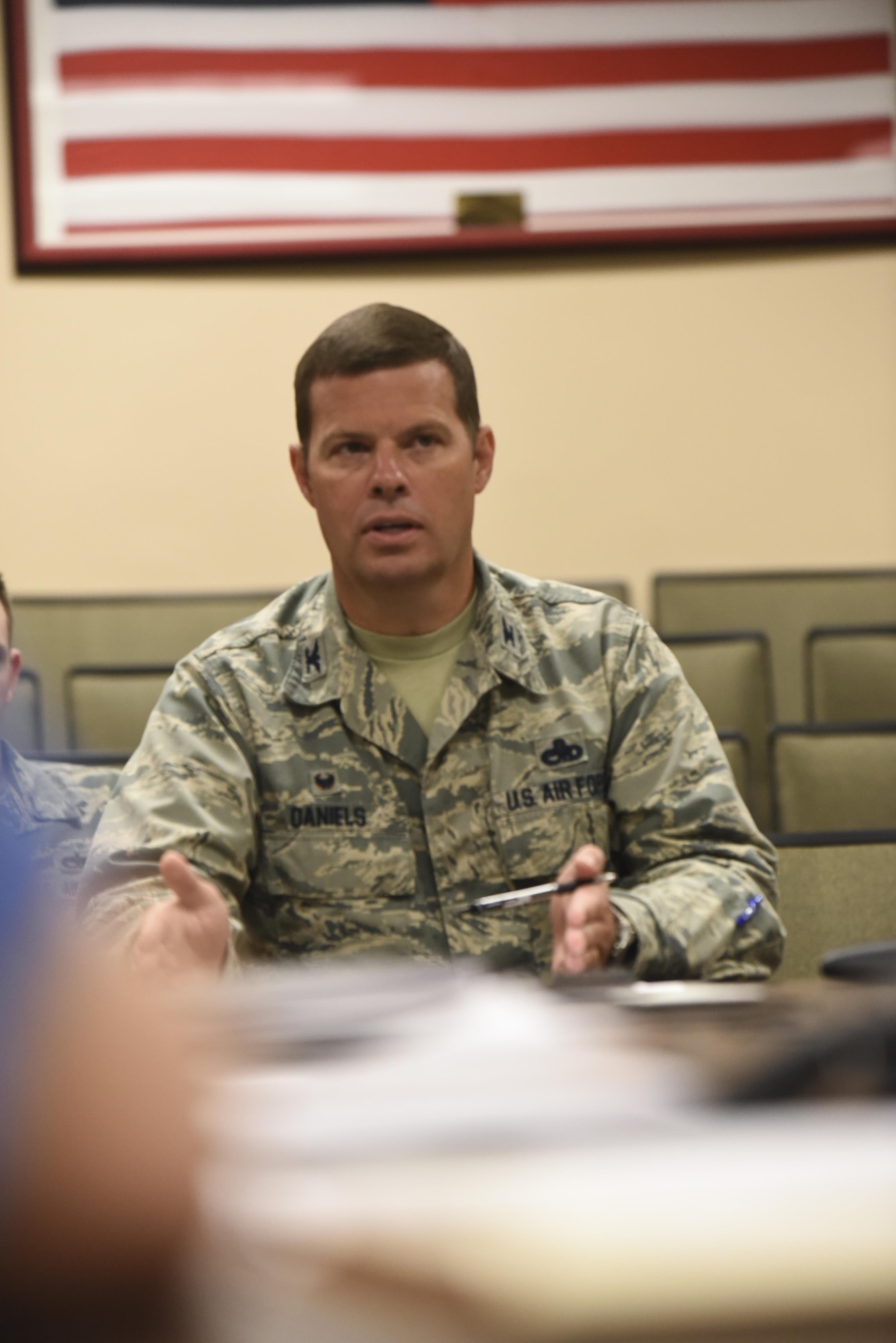 U.S. Air Force Col. Brian Daniels, 305th Maintenance Group commander, talks with Air Force Master Sgt. Shawn McDuff, 305th Maintenance Squadron team lead, and Boeing representatives about an initiative to overhaul the C-17 Globemaster III engine change process at Joint Base McGuire-Dix-Lakehurst, New Jersey, July 27, 2017. This initiative is to address areas of improvement in the engine change process to make it more efficient and cost effective. (U.S. Air Force photo by Airman 1st Class Jessica Blair)