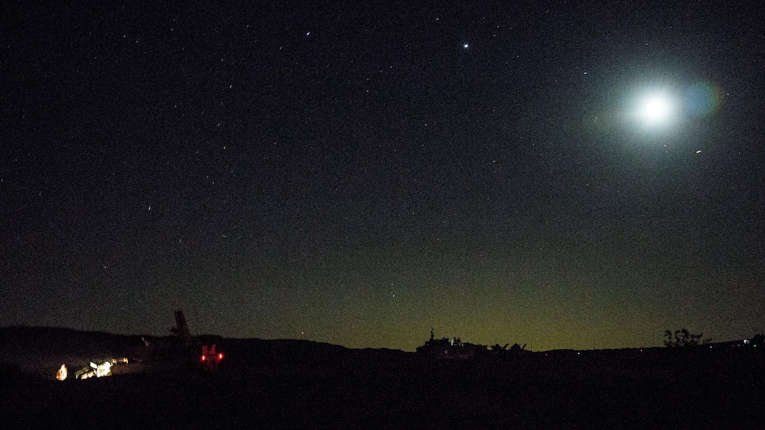 U.S. Marines with 1st Tank Battalion, Marine Air Ground Task Force-8 (MAGTF-8) conduct operational checks the night before a Tank Mechanized Assault Course (TMAC) during Integrated Training Exercise (ITX) 5-17 at Marine Corps Air Ground Combat Center, Twentynine Palms, Calif., July 27, 2017. The purpose of ITX is to create a challenging, realistic training environment that produces combat-ready forces capable of operating as an integrated MAGTF. (U.S. Marine Corps Photo by Sgt. Kassie L. McDole)