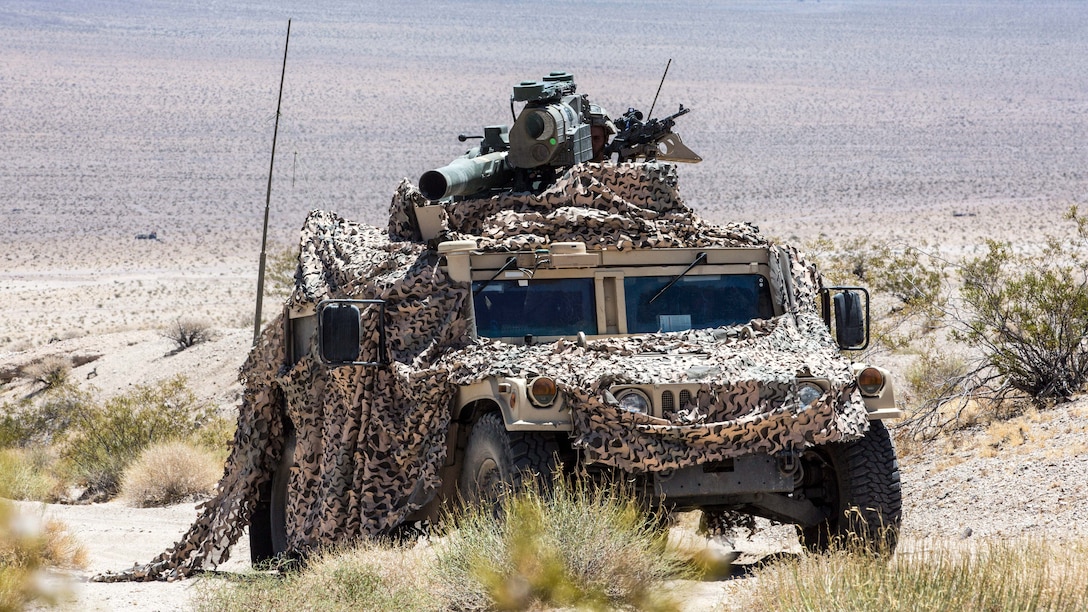 U.S. Marines with Combined Anti-Armor Team (CAAT), 1st Battalion, 1st Marine Regiment, Marine Air Ground Task Force-8 (MAGTF-8) maneuver to the next objective for a Tank Mechanized Assault Course (TMAC) during Integrated Training Exercise (ITX) 5-17 at Marine Corps Air Ground Combat Center, Twentynine Palms, Calif., July 28, 2017. The purpose of ITX is to create a challenging, realistic training environment that produces combat-ready forces capable of operating as an integrated MAGTF. (U.S. Marine Corps Photo by Sgt. Kassie L. McDole)