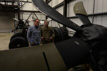 A U.S. Air Commando from the 352nd Special Operations Aircraft Maintenance Squadron gives actor Bryan Cranston a tour of the decentralized material support section July 29, 2017, during a United Service Organization Tour on RAF Mildenhall, England. After visiting Airmen and their families at the Bob Hope Community Center, Cranston toured the base, dined with Airmen and made a visit to the 352nd SOMXG. (U.S. Air Force photo by Staff Sgt. Micaiah Anthony)