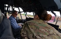 A U.S. Air Commando from the 352nd Special Operations Maintenance Group briefs actor Bryan Cranston, about the avionics systems of an MC-130 J Command II, July 29, 2017, during a United Service Organization Tour on RAF Mildenhall, England. Cranston toured the base to learn about Team Mildenhall’s mission and boost morale for Airmen and their families. (U.S. Air Force photo by Staff Sgt. Micaiah Anthony)