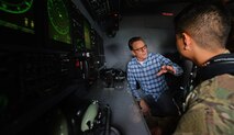 A U.S. Air Commando from the 352nd Special Operations Maintenance Group explains how the camera on an MC-130J Commando II works to actor Bryan Cranston, July 29, 2017, during a United Service Organization Tour on RAF Mildenhall, England. Cranston toured the base to learn about Team Mildenhall’s mission and boost morale for Airmen and their families. (U.S. Air Force photo by Staff Sgt. Micaiah Anthony)
