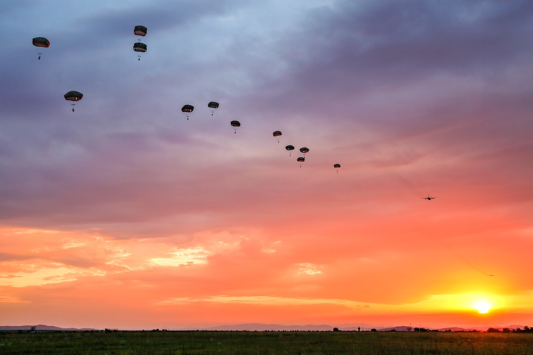 Paratroopers jump from a C-17 Globemaster while participating in a joint force entry during Exercise Saber Guardian at the Bezmer Training Area in Bezmer, Bulgaria, July 18, 2017. Army photo by Sgt. Matthew Hulett