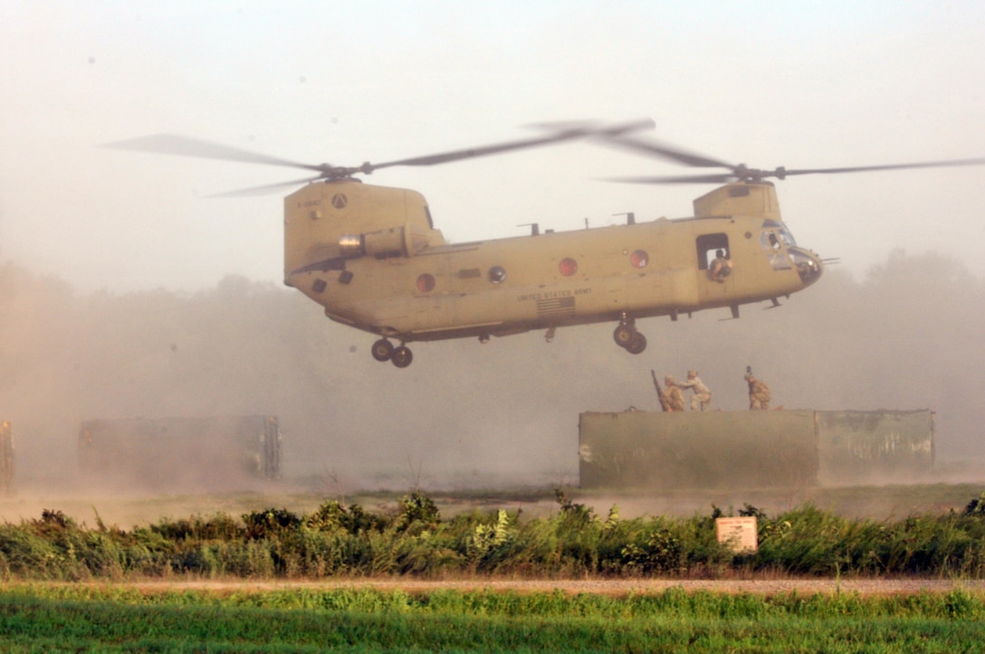 Three U.S. Army Soldiers from a Multi-Role Bridge Company team up to hook up an Improved Ribbon Bridge (IRB) Bay Section to a a CH-47 Chinook of Company B, 7th (General Support Aviation) Battalion, 158th Aviation Regiment, 244th Aviation Brigade, Army Reserve Aviation Command during River Assault 2017 on Fort Chaffee Manuever Training Center, July 26, 2017. The Chinook dropped off the bay in the Arkansas River in order for the IRB to be built across the river, the culminating event of River Assault. Operation River Assault is one of the key training events that demonstrates that America’s Army Reserve is the most capable, combat ready, and lethal Federal Reserve Force in the history of the nation. (U.S. Army Reserve Photo by Sgt. 1st Class Clinton Wood)