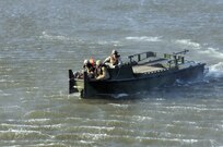 Three U.S. Army Soldiers from a Multi-Role Bridge Company in a MKII Bridge Erection Boat retrieve an Improved Ribbon Bridge (IRB) Bay Section that was dropped off by a CH-47 Chinook of Company B, 7th (General Support Aviation) Battalion, 158th Aviation Regiment, 244th Aviation Brigade, Army Reserve Aviation Command during River Assault 2017 on Fort Chaffee Manuever Training Center, July 26, 2017. The Bay was among several that formed a IRB across the river, the culminating event of River Assault. Operation River Assault, July 26, 2017. Operation River Assault is one of the key training events that demonstrates that America’s Army Reserve is the most capable, combat ready, and lethal Federal Reserve Force in the history of the nation. (U.S. Army Reserve Photo by Sgt. 1st Class Clinton Wood)