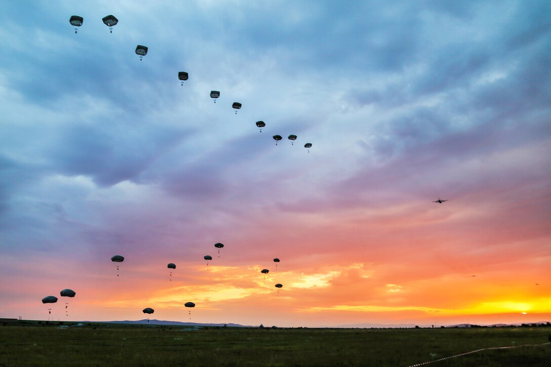Paratroopers jump from a C-17 Globemaster while participating in a joint force entry during Exercise Saber Guardian at the Bezmer Training Area in Bezmer, Bulgaria, July 18, 2017. Army photo by Sgt. Matthew Hulett