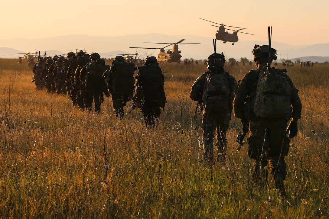 Paratroopers maneuver after offloading from Ch-47 Chinook helicopters while conducting an offensive operation during Exercise Saber Guardian at the Bezmer Training Area in Novo Selo, Bulgaria, July 21, 2017. Army photo by Sgt. Matthew Hulett