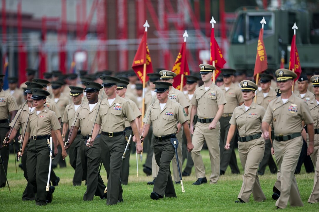 CAMP PENDLETON, CALIF. - U.S. Marines and Sailors with 1st Marine Logistics Group stand in formation on the Page Field House parade deck during the 1st MLG change of command ceremony at Camp Pendleton July 28, 2017.  Approximately 8,000 Marines and Sailors serve numerous occupational specialties within 1st MLG, encompassing six functions of logistics: supply, maintenance, transportation, general engineering, health services, and command services. (U.S. Marine Corps photo by Sgt. Rodion Zabolotniy)