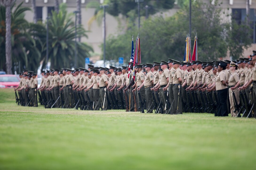 CAMP PENDLETON, CALIF. - U.S. Marines and Sailors with 1st Marine Logistics Group stand in formation on the Page Field House parade deck during the 1st MLG change of command ceremony at Camp Pendleton July 28, 2017.  Approximately 8,000 Marines and Sailors serve numerous occupational specialties within 1st MLG, encompassing six functions of logistics: supply, maintenance, transportation, general engineering, health services, and command services. (U.S. Marine Corps photo by Sgt. Rodion Zabolotniy)