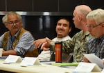 Kane Evan and Victor Lord, members of the Nenana Native Council, Nenana, Alaska, talk with Master Sgt. Travis Oaks, quality assurance for the 213th Space Warning Squadron, Clear Air Force Station, Alaska, during a break at the tribal relations meeting at Clear Air Force Station, Alaska, July 12, 2017. Evan and Lord, along with several other members of the Nenana Native Council, were invited to the meeting by Air Force and Air National Guard personnel in order to reestablish relations with the Alaskan Natives. 