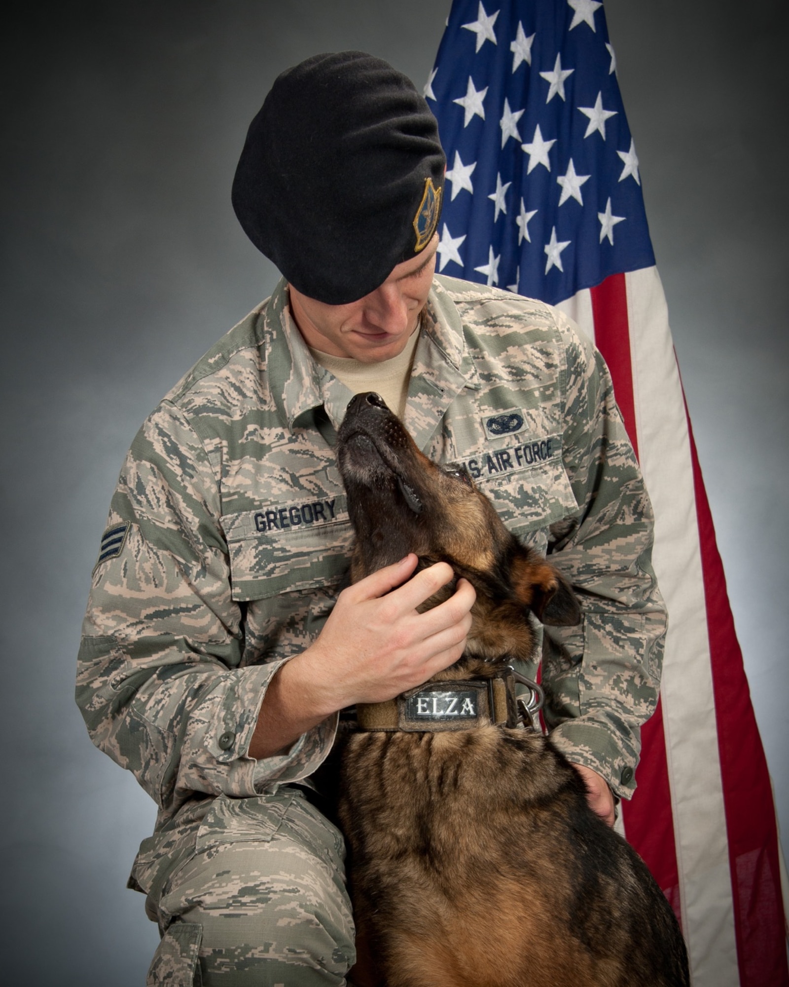 Senior Airman Clinton Gregory, 42nd Security Forces Squadron military working dog handler, with his MWD Elza at Maxwell Air Force Base, Ala. Gregory said this photo illustrates Elza’s playful nature and the bond the two had formed while working together. Elza succumbed to cancer in early July 2017 months before she was set to retire. (Courtesy photo)