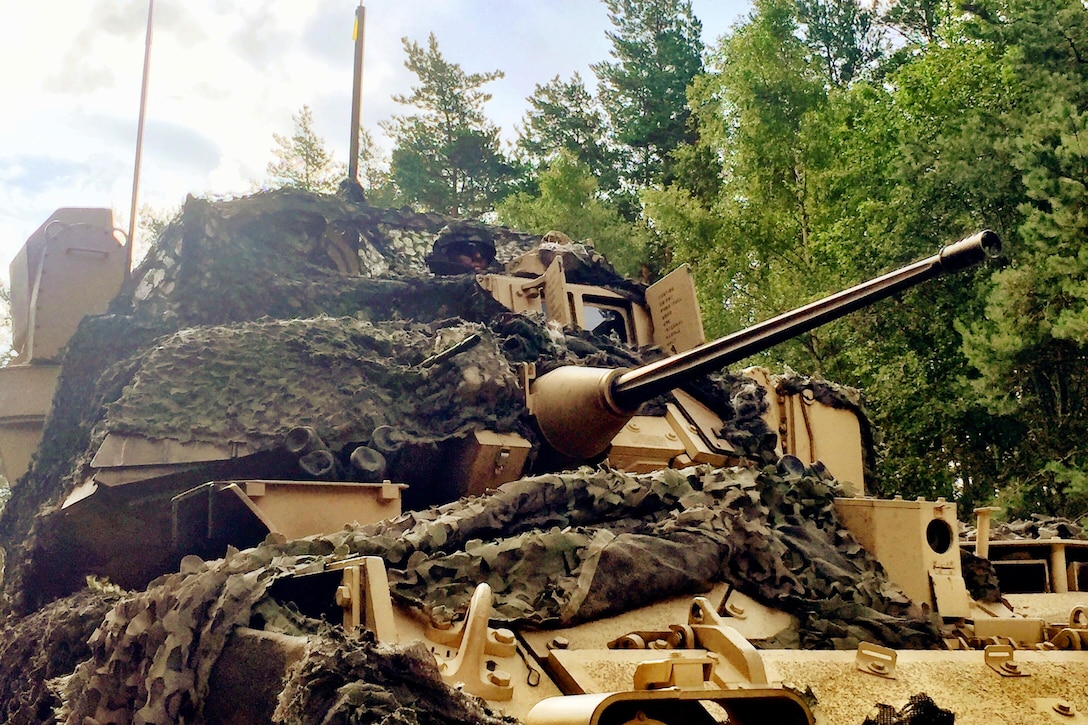 An M2A3 Bradley Fighting Vehicle crew moves to engage a target during a live-fire exercise at the Grafenwoehr Training Area, Germany, July 28, 2017. Army photo by Capt. Scott Walters