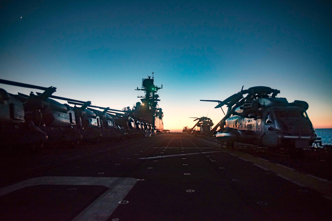 Helicopters sit idle on the deck of the amphibious assault ship USS Bonhomme Richard, July 29, 2017. Navy photo by Petty Officer 3rd Class William Sykes
