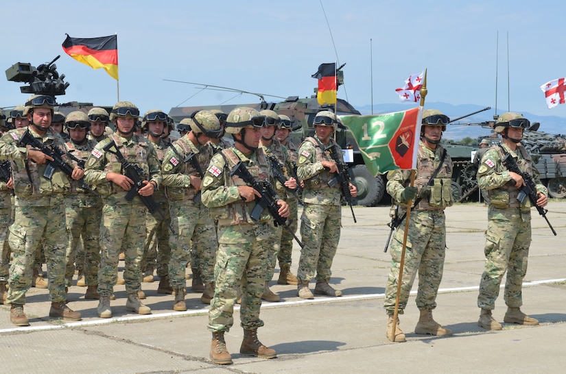 Georgian troops wait in formation during rehearsals for the opening ceremonies of exercise Noble Partner at Vaziani Military Base, Georgia, July 30, 2017. Noble Partner is a multinational, U.S. Army Europe-led exercise conducting home station training for the Georgian light infantry company designated for the NATO Response Force. Army photo by Sgt. Shiloh Capers