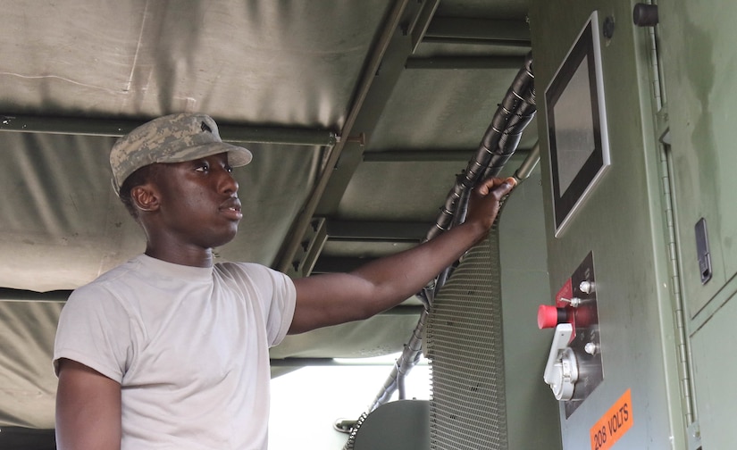 U.S. Army Reserve Sgt. Michael Jatta, a shower/laundry and clothing repair specialist with the 242nd Quartermaster Company, maintains a Laundry Advanced System during the two-week 2017 Quartermaster Liquid Logistics Exercise at Fort Stewart, GA, Jul. 14 to 27, 2017.  QLLEX allows U.S. Army Reserve units to demonstrate their skills and provide real-world fuel and water support while training at the tactical, operational, and strategic level.  (U.S. Army Reserve Photo by Maj. Brandon R. Mace)