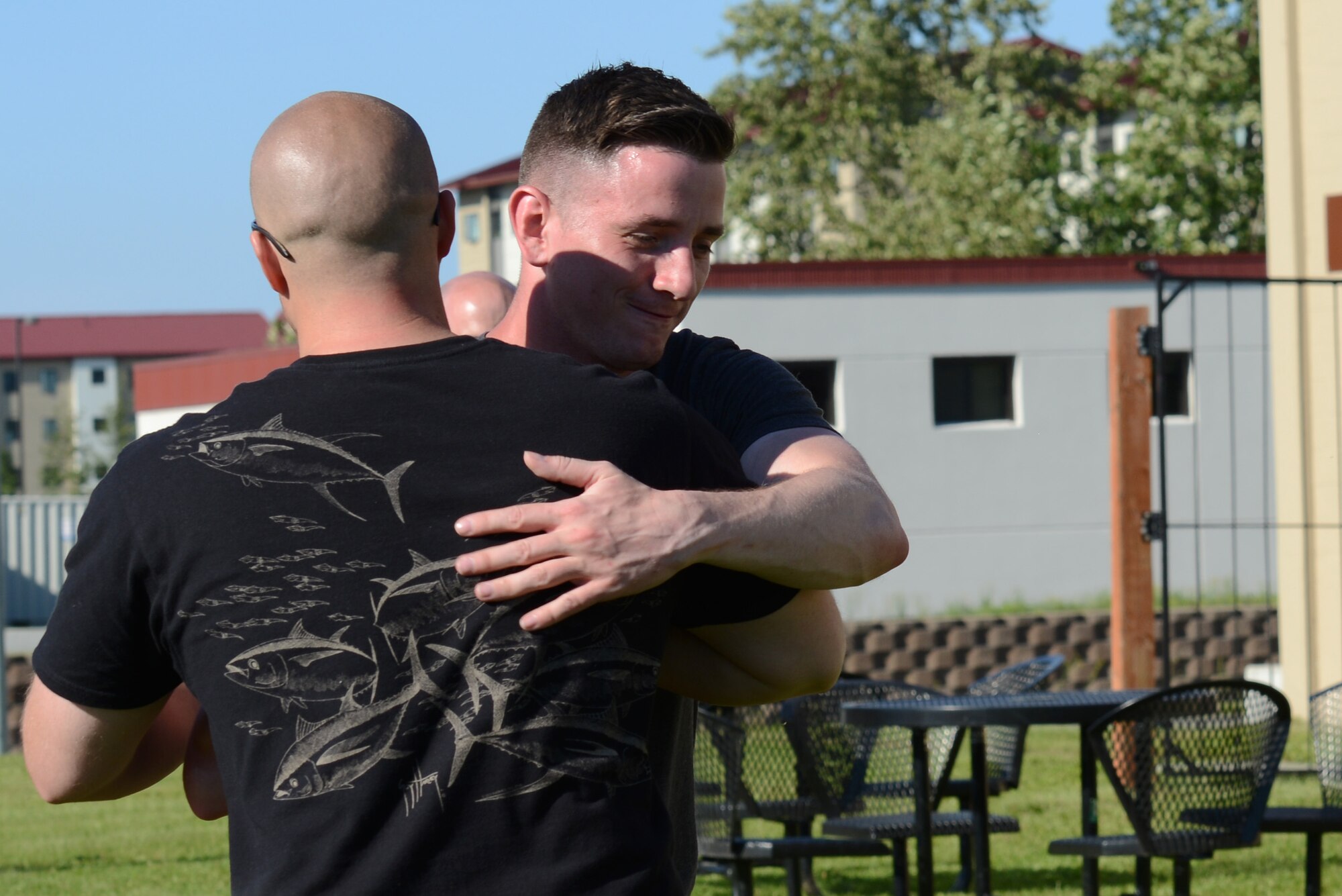 James Balkcom (left) and Matthew Knoll celebrate their victory from the losing bracket at a cornhole tournament at the Warrior Zone at Joint Base Elmendorf-Richardson, Alaska, July 22, 2017. The tournament had a total of 18 teams and played a double-elimination bracket, meaning a team was eliminated if they lost twice. 