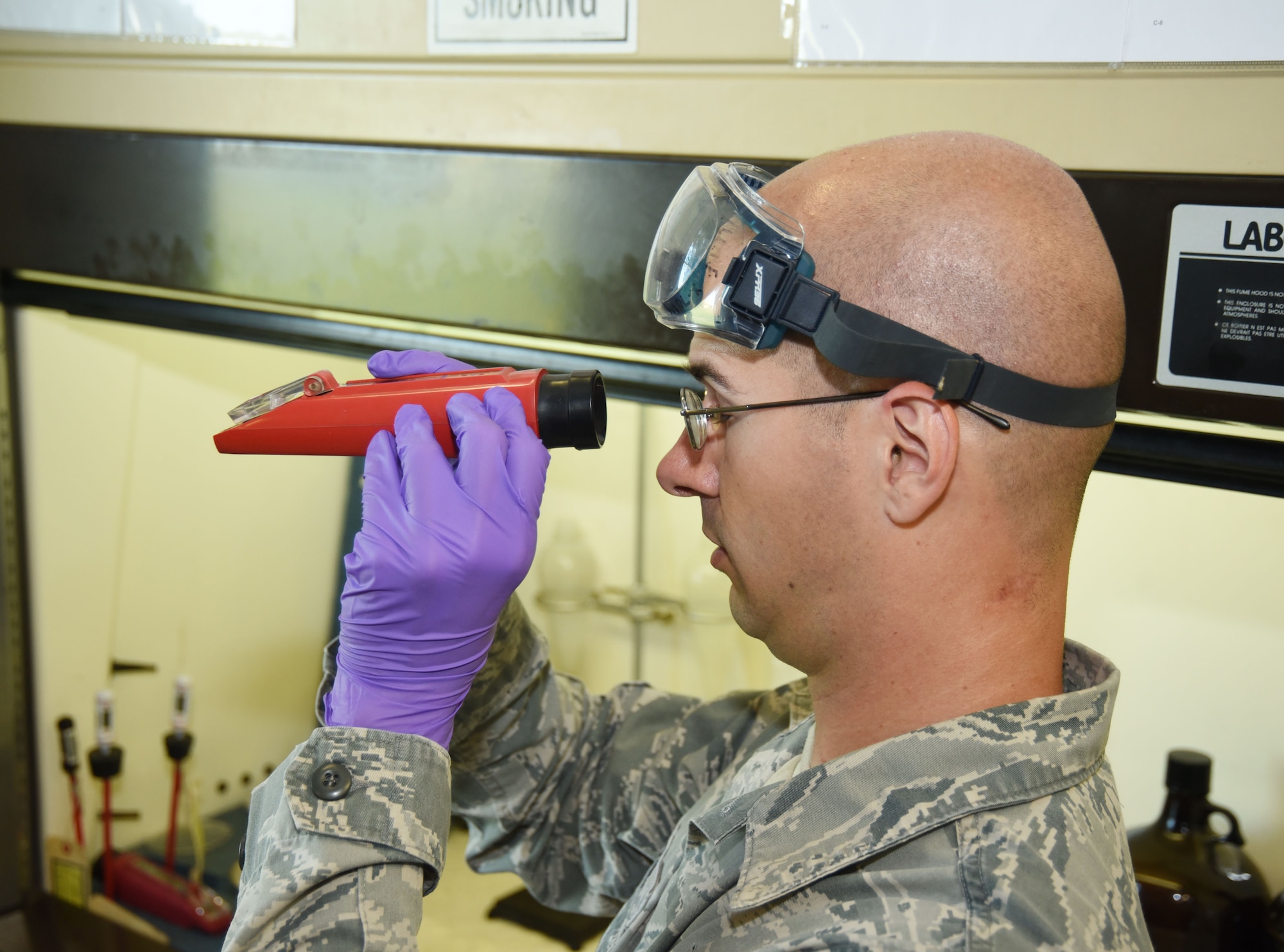 AVIANO AIR BASE, Italy -- Staff Sgt. Wesley Foster, a 301st Fighter Wing’s Logistics Readiness Squadron fuels distribution operator from Naval Air Station Fort Worth Joint Reserve Base, Texas, looks through a refractometer in the 31st Fighter Wing's Petroleum, Oils, and Lubricants lab here. A refractometer helps Foster measure the level of Fuel system icing inhibitor (FSII) in fuel to prevent freezing or clogs in aircraft fuel lines. This lab work ensures the fuel quality meets the standards and specifications of safety and effectiveness to maintain daily operations.  (U.S. Air Force photo by Tech. Sgt. Jeremy Roman)