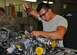 Senior Airman Stephen Cruz, a 592nd Special Operations Maintenance Squadron propulsion technician, connects a safety wire on a C-146 engine component at Duke Field, Fla., recently.  The active-duty squadron works alongside its Air Force Reserve maintenance counterparts at Duke to maintain engines on both C-145 and C-146 aircraft. (U.S. Air Force photo/Dan Neely)