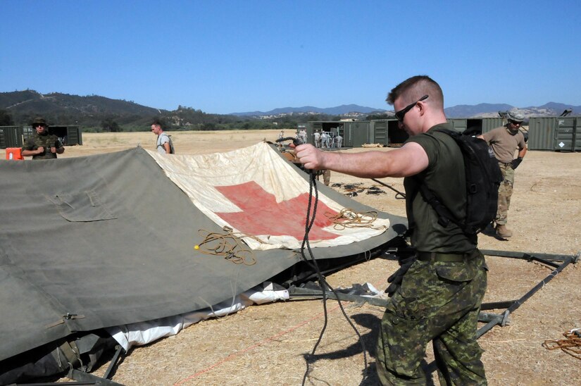 3rd Medical Command (Deployment Support)’s 345th Combat Support Hospital out of Jacksonville, Florida, commanded by Col. Noel Pace, is one of the training audiences participating in Global Medic 2017 at Fort Hunter Liggett, California.  The nearly 250 Soldiers assigned to the CSH spent the first few days setting up the hospital and getting it ready to begin receiving patients.  The exercise runs 8-28 July, 2017.
Global Medic’s unique training opportunity allows U.S. Army Reserve medical units to train alongside their multi-component and joint partners as part of the America’s Army Reserve evolution into the most lethal Federal Reserve force in the history of the nation.  The training audience for this year’s Global Medic exercise totaled more than 1,100 service members, ensuring individuals, teams and units are better prepared to provide medical care when they are called to deploy.