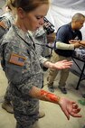 1st Lt. Rebecca Milligan, a medical-surgical nurse assigned to the 7407th Troop Medical Clinic, receives training from Mr. Cory Soto, the Emergency Medical Technician lead instructor for Regional Training Site-Medical Camp Parks.  Soto shares moulage techniques with Soldiers to ensure the training audience participating in CSTX 91-17-03 Global Medic has the most realistic patient scenarios on the battlefield. Moulage is the art of applying mock injuries for the purpose of simulating real-world experience for emergency medical training.
Global Medic’s unique training opportunity allows U.S. Army Reserve medical units to train alongside their multi-component and joint partners as part of the America’s Army Reserve evolution into the most lethal Federal Reserve force in the history of the nation.  The training audience for this year’s Global Medic exercise totaled more than 1,100 service members, ensuring individuals, teams and units are better prepared to provide medical care when they are called to deploy.