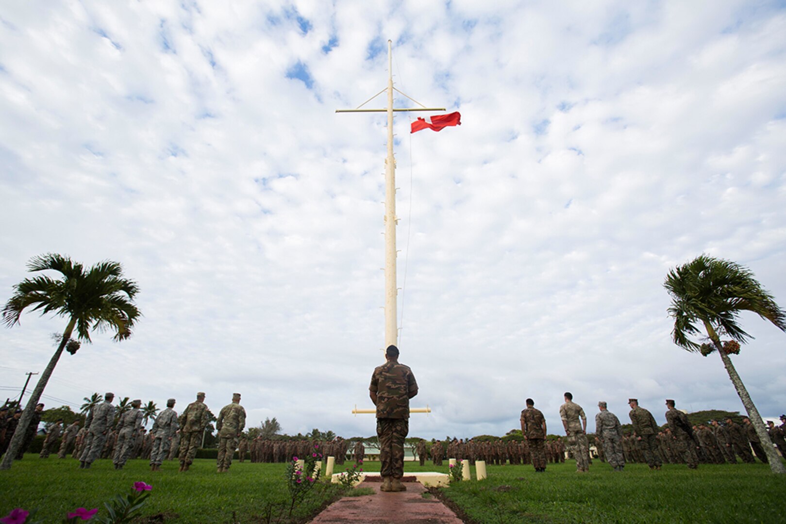 U.S. Marines and sailors with Task Force Koa Moana 17, Tonga’s His Majesty’s Armed Forces, French soldiers and members of the New Zealand Defense Force stand at attention as a Tongan flag is raised during the opening ceremony of Exercise TAFAKULA July 17 on Tongatapu Island, Tonga. The ceremony marks the start of two weeks of infantry and law enforcement training between the militaries. 