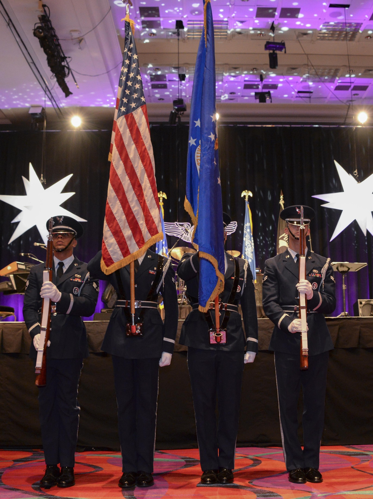 The Honor Guard from Travis Air Force Base, Calif., present the colors at the Air Force Sergeants Association International Convention in Reno, Nevada. This signified the beginning of the Air Force Honors Banquet, which was the final event for the Professional Airmen's Conference. (U.S. Air Force photo by Senior Airman Amber Carter)