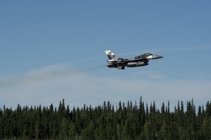 A U.S. Air Force F-16 Aggressor takes off from the flight line during RED FLAG-Alaska 17-2 June 13, 2017, at Eielson Air Base, Alaska. RED FLAG-Alaska provides an optimal training environment in the Indo-Asia Pacific Region and focuses on improving ground, space, and cyberspace combat readiness and interoperabillity for U.S. and international forces.  