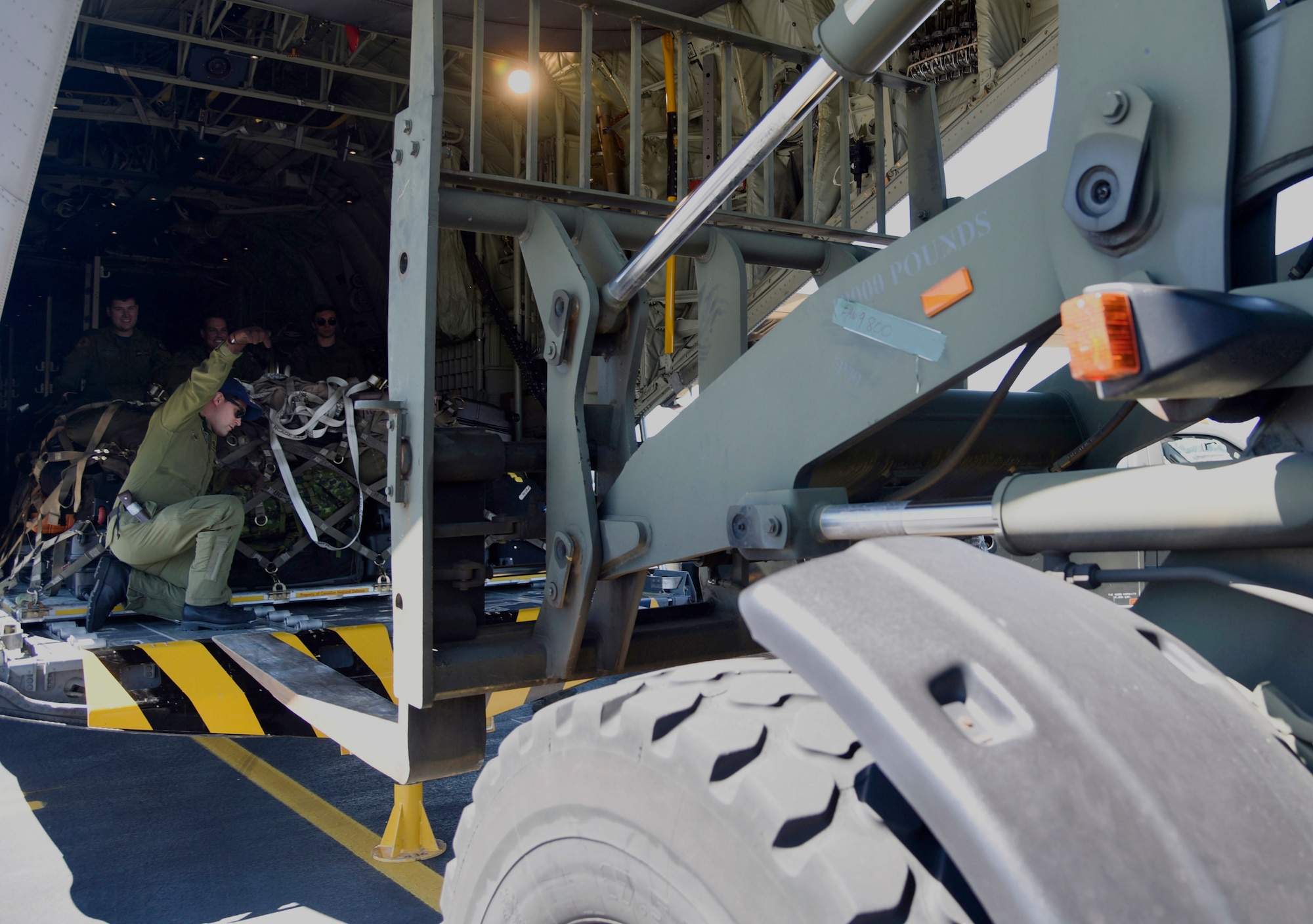 Airmen assigned to the Canadian Forces Aeromedical Evacuation Unit and the 436th Transport Squadron work with Airmen assigned to the 62nd Aerial Port Squadron to unload pallets as they arrive at Joint Base Lewis-McChord, Wash., July 29, 2017. The airmen traveled from Canadian Forces Base Trenton, Quinte West, Ontario as participants in the exercise.  More than 3,000 Airmen, Soldiers, Sailors, Marines and international partners will converge on the state of Washington in support of Mobility Guardian. The exercise is intended to test the abilities of the Mobility Air Forces to execute rapid global mobility missions in dynamic, contested environments. Mobility Guardian is Air Mobility Command's premier exercise, providing an opportunity for the Mobility Air Forces to train with joint and international partners in airlift, air refueling, aeromedical evacuation and mobility support. (U.S. Air Force photo by Airman 1st Class Erin McClellan)