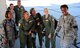 At right, Staff Sgt. Anisa Thomas, from the Health Service Management career field, and currently the 932nd Aeromedical Evacuation Squadron Ground Training Noncommissioned Officer in Charge, smiles as she prepares to help escort her 