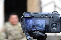 Sgt. Ian Rivera-Aponte conducts an interview July 25 during a photoshoot at the urban assault course on Joint Base McGuire-Dix-Lakehurst, New Jersey.  Rivera-Aponte was one of six Soldiers who were recently flown into JBMDL for a photoshoot with Army Reserve Communications, Army Marketing and Research Group and United States Army Recruiting Command.  He’ll be featured on upcoming commercials and posters.  He is currently assigned to the 100th Infantry Battalion out of Fort Shafter, Hawaii as an infantryman and sniper.