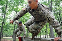 Sgt. Andrew Paredes (front) and Sgt. Ian Rivera-Aponteare photographed July 27 on the obstacle course at Joint Base McGuire-Dix-Lakehurst, New Jersey.  The Soldiers were recently flown into JBMDL for a photoshoot with Army Reserve Communications, Army Marketing and Research Group and United States Army Recruiting Command.  They’ll be featured on upcoming commercials and posters.