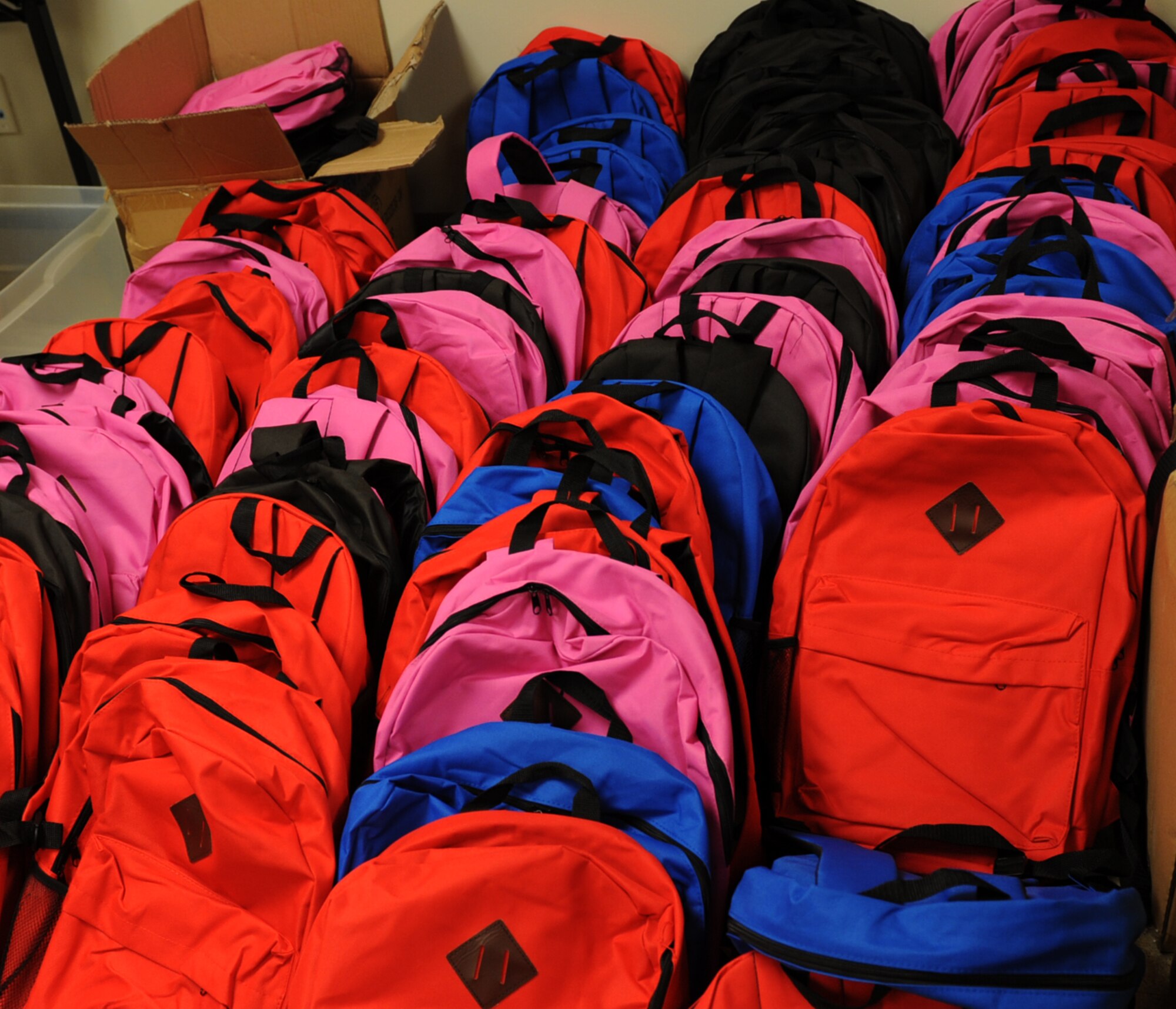 Backpacks filled with school supplies are displayed during the School Supply Giveaway, July 31, 2017, at McConnell Air Force Base, Kan. The supplies were donated to Operation Homefront who in turned gave them away to military families E-5 and below. The giveaway is scheduled to run July 31 through August 4 from 10 a.m. to 2 p.m. (U.S. Air Force photo/Staff Sgt. Rachel Waller)