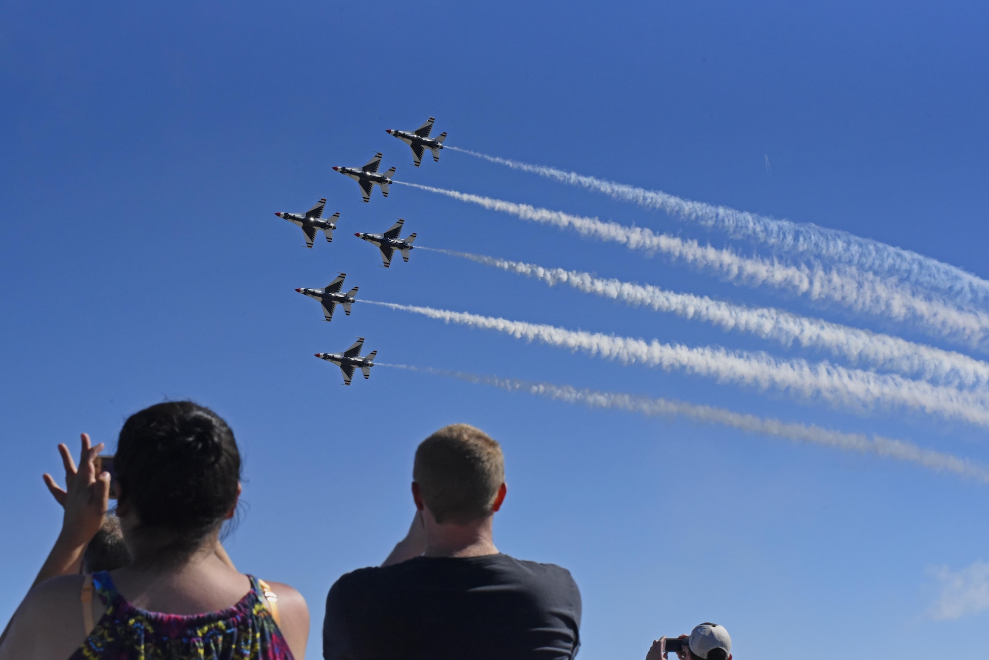 Spectators watch as the U.S. Air Force Aerial Demonstration Squadron, the Thunderbirds, perform during SkyFest 2017 Air Show and Open House July 30, 2017, at Fairchild Air Force Base, Washington. The Thunderbirds are the Air Force’s premiere aerial demonstration team who perform at various military bases and civilian air shows around the world. (U.S. Air Force photo/Senior Airman Nick J. Daniello)