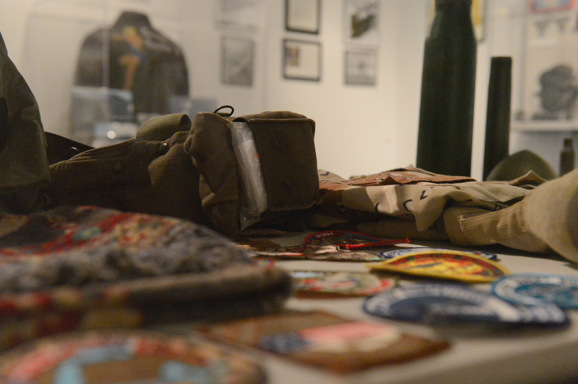 Patches and military uniform articles are on display in the Operation Desert Storm display case at the Barksdale Global Power Museum on Barksdale Air Force Base, La., July 12, 2017. Barksdale Air Force Base played an important role during Desert Storm through different operations and training.