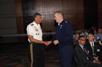 U.S. Army Gen. Vincent K. Brooks (left), commander of U.S. Forces Korea, United Nations Command and Republic of Korea-U.S. Combined Forces Command, is thanked by U.S. Air Force Gen. John. E. Hyten, commander of U.S. Strategic Command (USSTRATCOM), during USSTRATCOM’s annual Deterrence Symposium at the CenturyLink Center, Omaha, Neb., July 26, 2017. During the two-day symposium, industry, military, governmental, international and academic experts discussed and promoted increased collaboration to address 21st century strategic deterrence.  One of nine Department of Defense unified combatant commands, USSTRATCOM has global strategic missions assigned through the Unified Command Plan that include strategic deterrence, space operations, cyberspace operations, joint electronic warfare, global strike, missile defense, intelligence, and analysis and targeting.