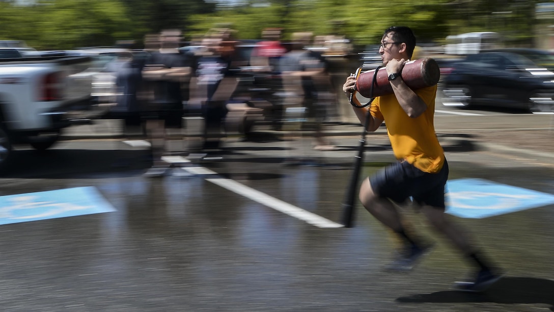 Navy Petty Officer 2nd Class Daniel Jones represents the destroyer USS Momsen during the 23rd annual Trident Training Facility's Damage Control Olympics at Naval Base Kitsap-Bangor, Wash., July 28, 2017. Jones is a machinist's mate (nuclear). The event features competitions between Pacific Northwest commands. Navy photo by Petty Officer 2nd Class Class Wyatt L. Anthony