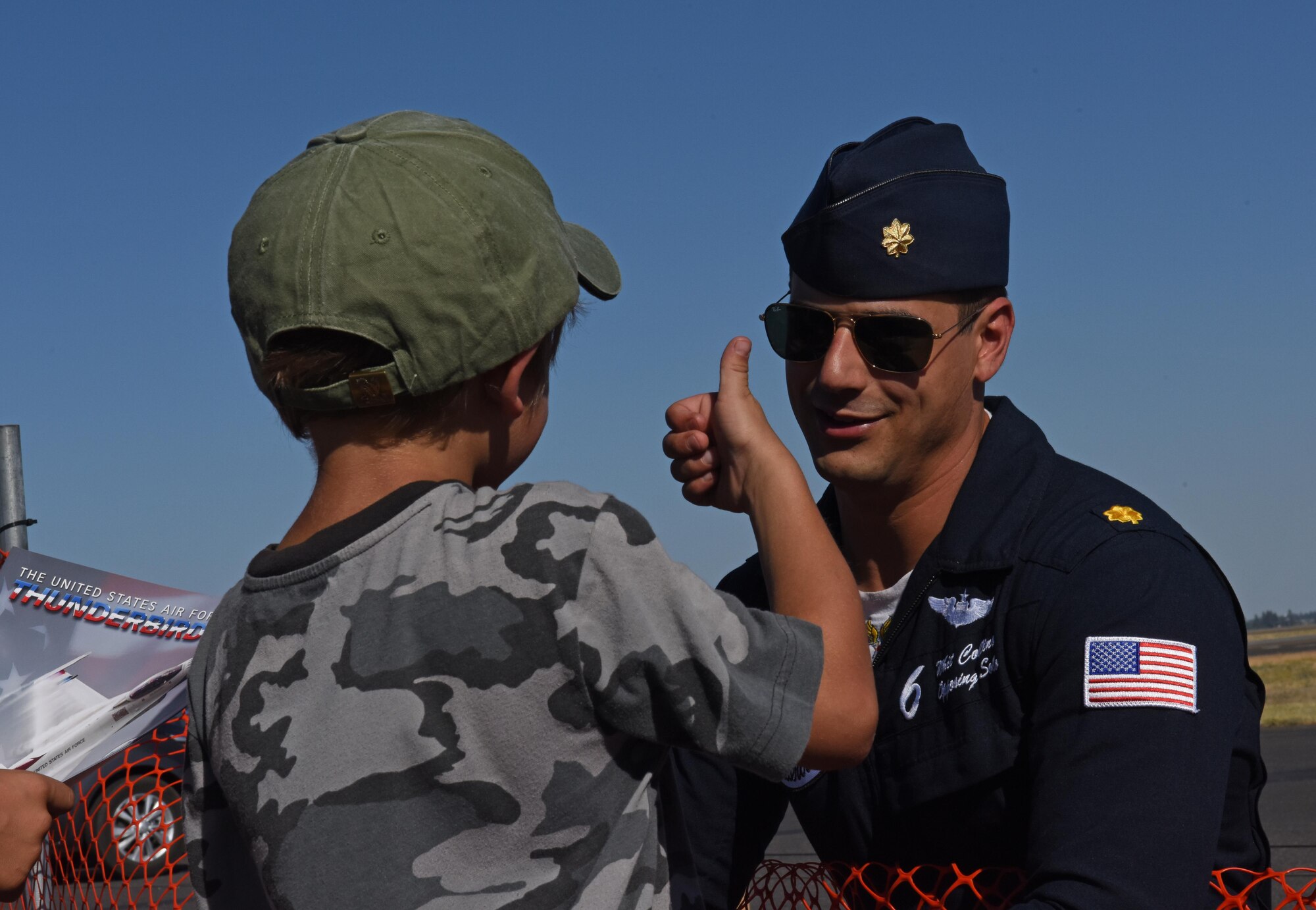 Maj. Whit Collins, solo pilot for the U.S. Air Force Thunderbirds, talks to air show guests during the 2017 Skyfest Air Show and Open House July 29, 2017, at Fairchild Air Force Base, Washington. Skyfest gives the local and regional community the opportunity to view Airmen and Air Force resources. This is Collins’ first season with the team, flying jet number six. (U.S. Air Force photo/Airman 1st Class Jesenia Landaverde)