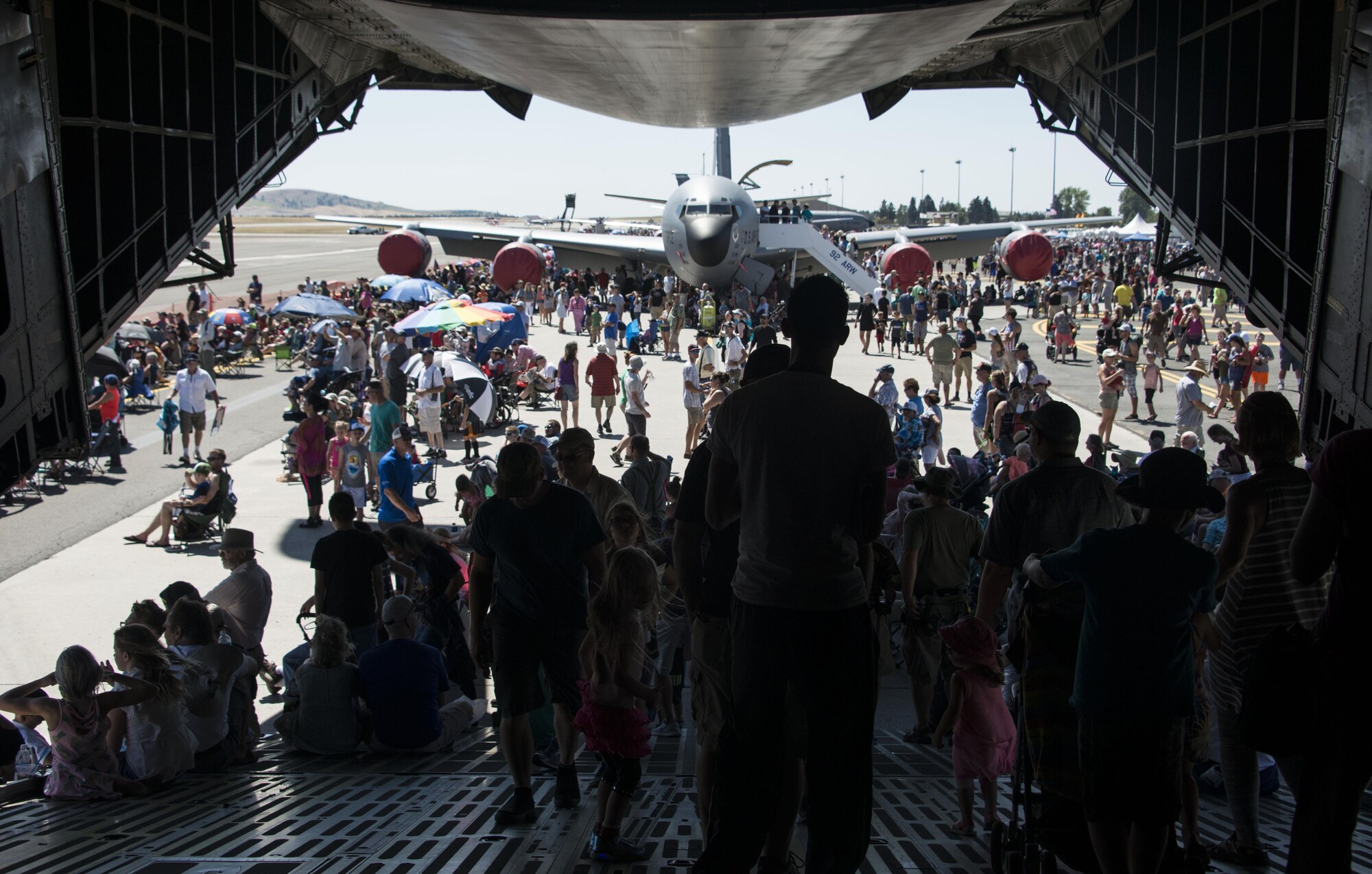 Service members and members from the local community walk off a C-5 Galaxy during SkyFest 2017 Air Show and Open House at Fairchild Air Force Base, Washington, July 29, 2017. SkyFest is Fairchild’s air show and open house to give the local and regional community the opportunity to meet Airmen and learn about the Air Force mission. (U.S. Air Force photo/Senior Airman Janelle Patiño)