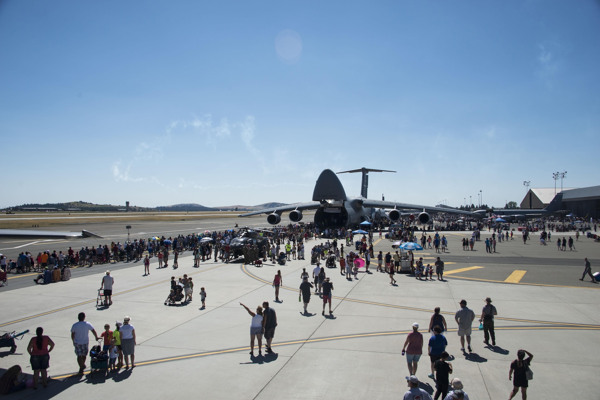 Service members and members from the local community gathered at Fairchild Air Force Base, Washington, during the SkyFest 2017 Air Show and Open House at Fairchild Air Force Base, Washington, July 29, 2017. SkyFest is Fairchild’s air show and open house to give the local and regional community the opportunity to view Airmen and our resources. (U.S. Air Force photo/Senior Airman Janelle Patiño)