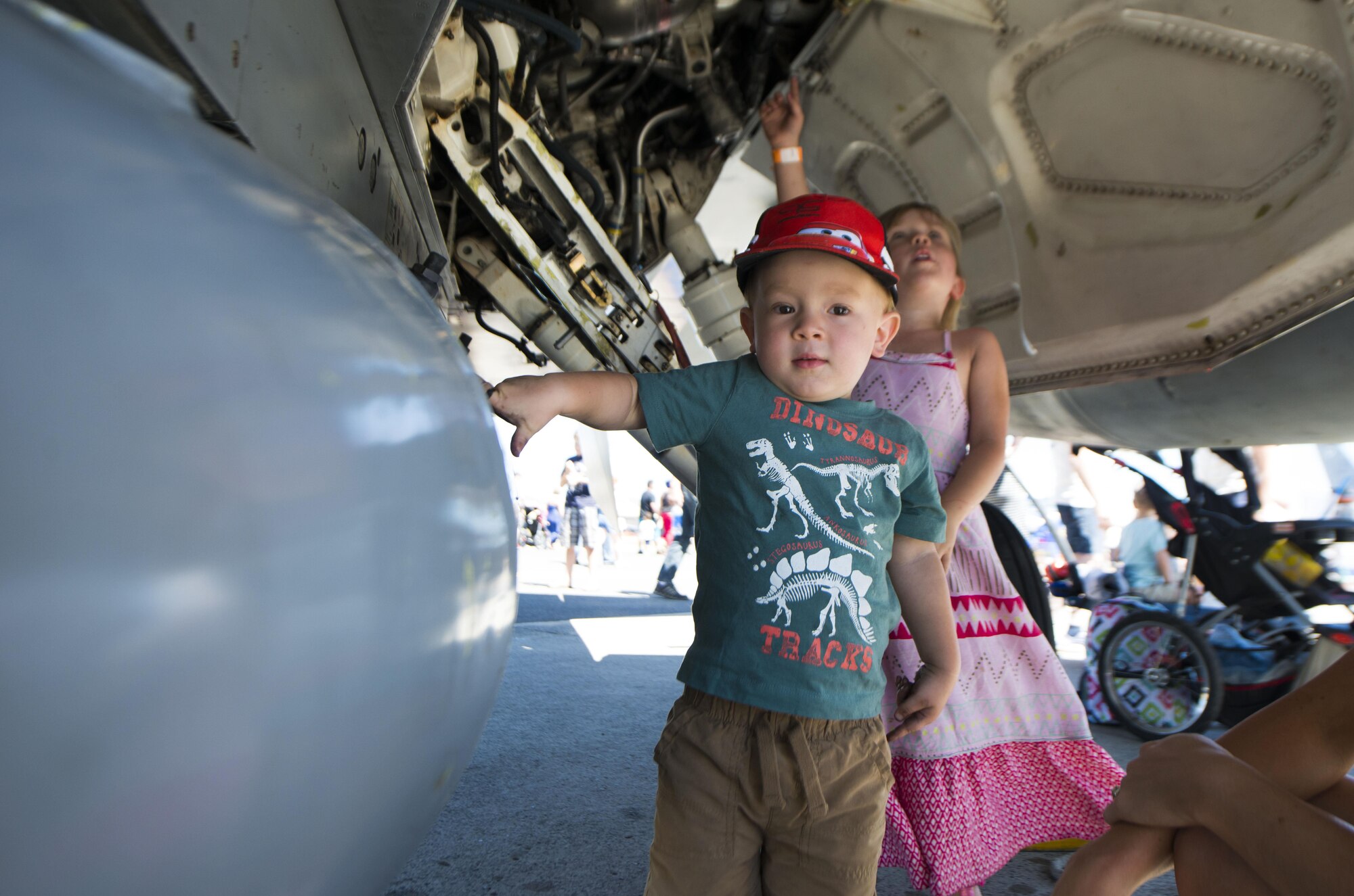 A child touches an aircraft during SkyFest 2017 Air Show and Open House at Fairchild Air Force Base, Washington, July 30, 2017. SkyFest was hosted to thank the local and regional community for their support and give them the opportunity to meet Airmen and learn about the Air Force mission. (U.S. Air Force photo/Senior Airman Janelle Patiño)