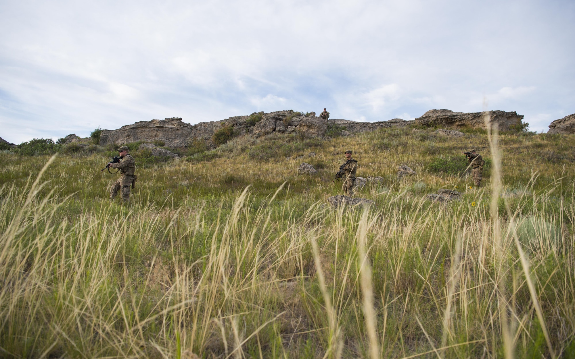 Defenders from Minot Air Force Base’s 791st Missile Security Forces Squadron, sweep the area for improvised explosive devices during a counter IED course at Camp Guernsey, Wyo., July 19, 2017. The 620th Ground Combat Training Squadron offers multiple counter IED course’s placing the defenders in multiple scenarios where they need to avoid or locate the IED’s while simultaneously completing their primary mission. (U.S. Air Force photo by Staff Sgt. Christopher Ruano)

