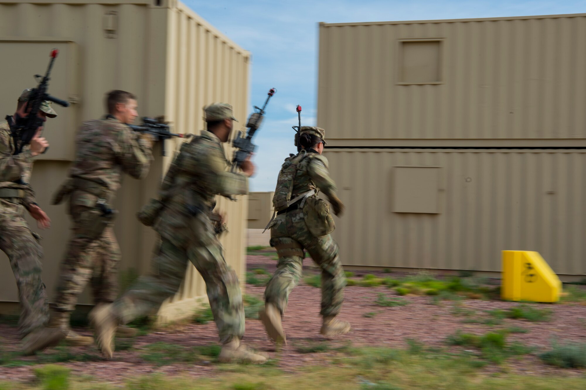 Defenders from Minot Air Force Base’s 791st Missile Security Forces Squadron, sprint to cover during an urban improvised explosive device course at Camp Guernsey, Wyo., July 19, 2017. Defenders are placed in multiple scenarios to include search and rescue and capturing enemy held positions. (U.S. Air Force photo by Staff Sgt. Christopher Ruano)

